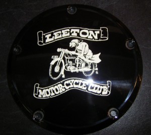 Motor Cycle side cover with a design produced by sandblasting and paint filling       